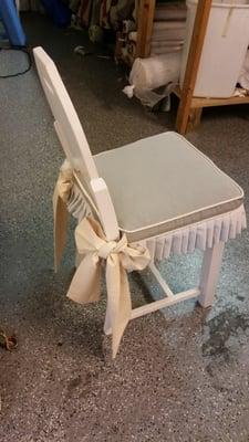 Dining chair cushion with bows and pleated skirts