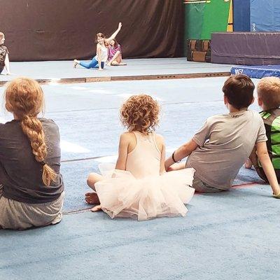 Our youngest participant watches the contortion act!