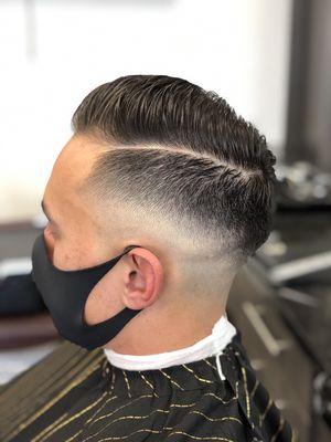 Low medium skin fade with the comp over