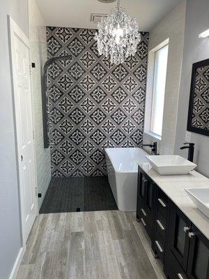 Finished photo of a custom shower and full bathroom remodel. Complete with a beautiful chandelier!