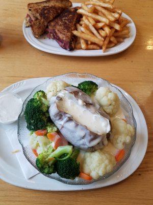 Baked potato with veg and cheese sauce