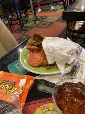 The is my wife plate the buffalo chicken sandwich with onion rings!! They were over cooked and went it arrived it's was cold!!!