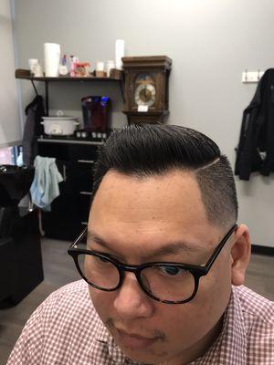 Side part with a fade and hard part