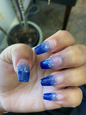 Blue acrylic ombré nail coffin shape with glitter