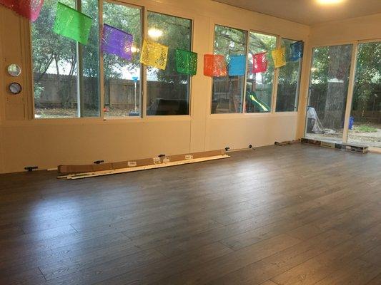 Installed laminate floor in sunroom.