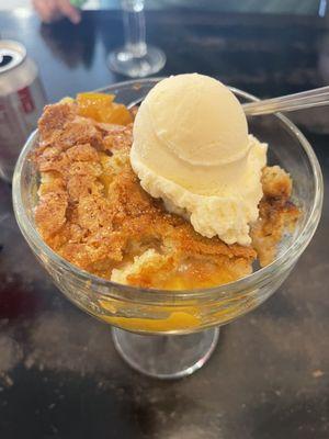 Peach cobbler with vanilla ice cream