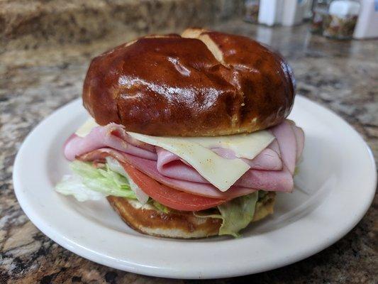 Bavarian Boy sandwich. Black Forest Ham, Swiss, brown mustard on a pretzel bun.