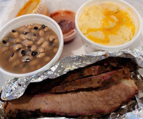 Beef Brisket Entree Platter with Black Eyed Peas and Cheese Grits