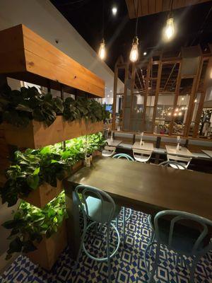 Tables and greenery.