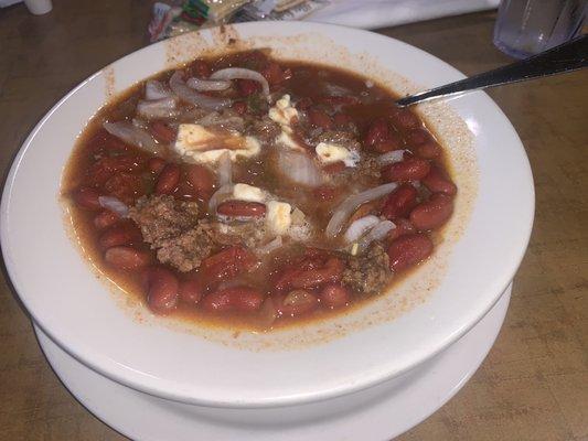 Bowl of Chili with dices onions and butter. Excellent