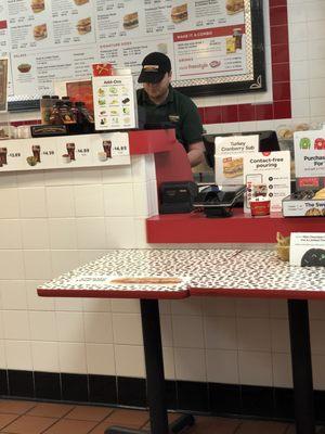 Maskless man preparing food