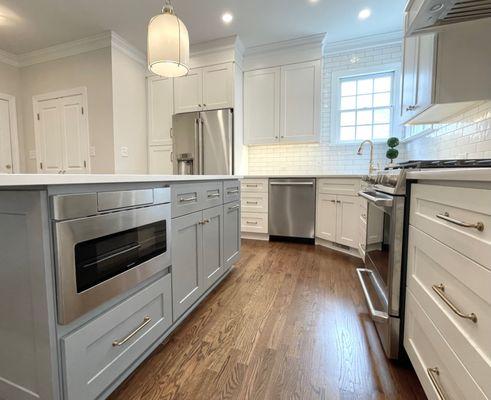 New Layout. New Cabinets. Quartz counters. New appliances and lighting. New floors and tile backsplash. Cary, NC