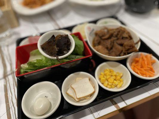 Toppings for the noodle bowl.