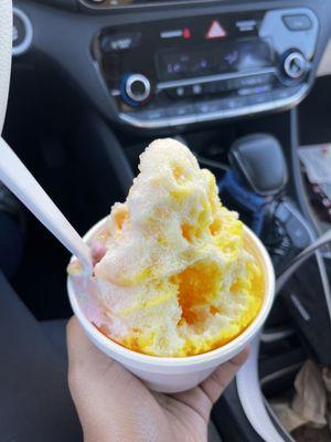 Rainbow sherbet ice cream with orange piña and mango shaved ice!! Drizzled with sweet cream!!