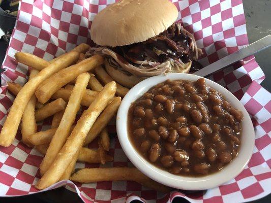 Pulled pork sandwich with beans and fries