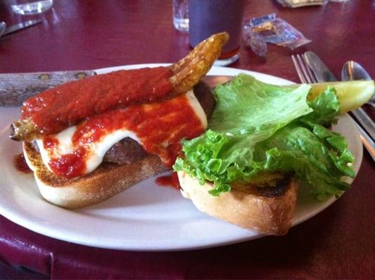 Sausage patty and grilled pepper sandwich.