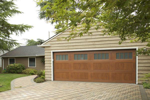 Beautiful impression style garage door designed to mimic natural wood.