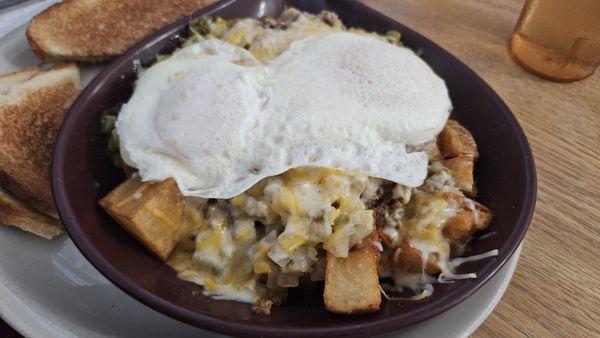 TPI Skillet. American Fries (aka large diced potatoes). Hash browns would be better. Nacho Meat (nicely seasoned ground beef).