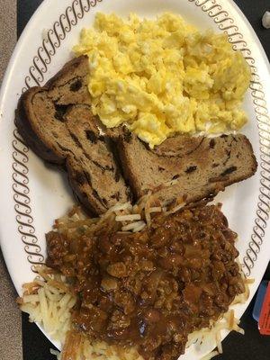 Scrambled, Raisin Toast and Hash Browns covered in Bert's Chili