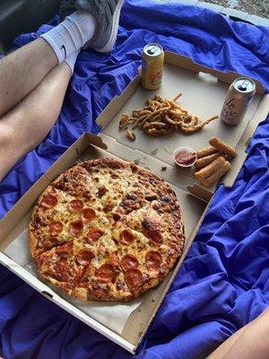 Half pepperoni half cheese pizza. Onion fries & mozzarella sticks