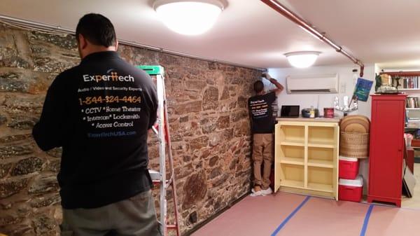 our Team installing projector screen and ceiling speakers