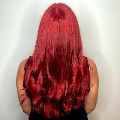 Vibrant red hair color from Versa Salon, your destination for the best hair color in Charlotte, NC.