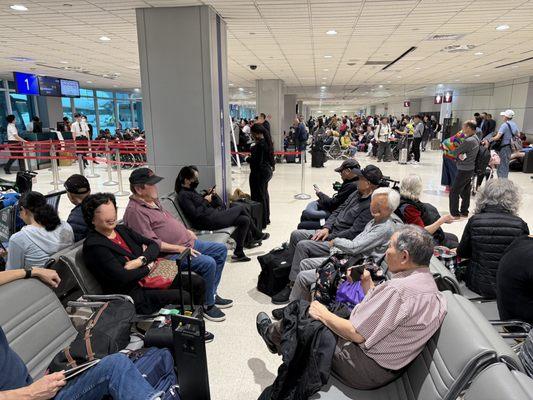 The busy waiting area at Eva connecting gates at Taipei's airport.