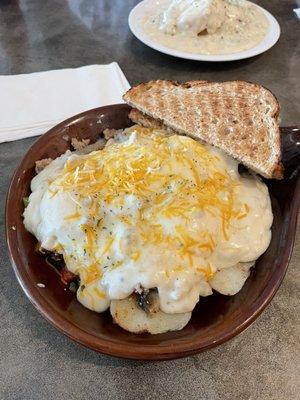 Grandpa skillet with over easy eggs and wheat toast