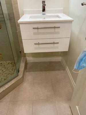 One of two bathrooms with free standing sink installed (After)