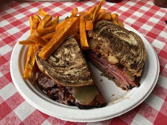 Big D Sandwich made with Corned Beef and sweet potato fries.