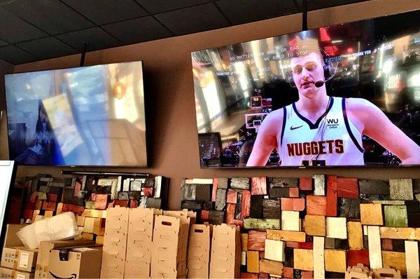 Two flat screen TVs in the seating area.