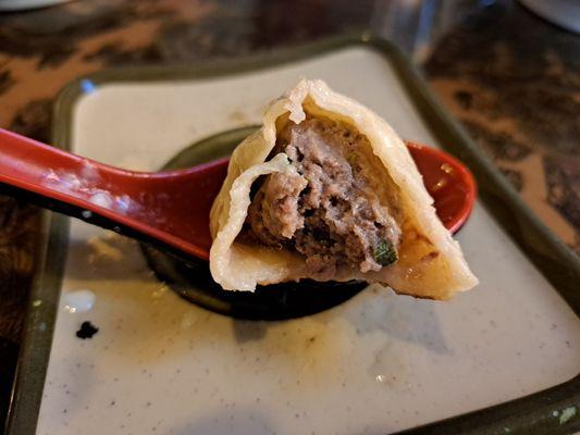 Inside Buuz, pan-fried Mongolian beef dumplings, which are larger than bansh. These are available daily.