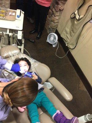 Toddler Girl bravely allows hygienist to polish her little baby teeth! Hygienist is friendly and gentle!