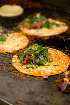 A closer look reveals the soul of our kitchen: our Quesabirria Tacos.