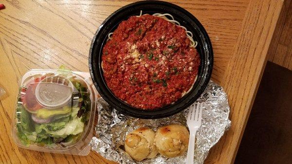 Spaghetti with meat sauce.  Comes with 2 garlic knots, and side salad.  Feeds about 4.