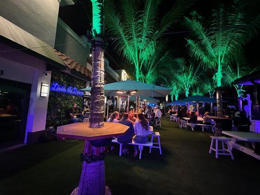 The covered picnic tables on the turf