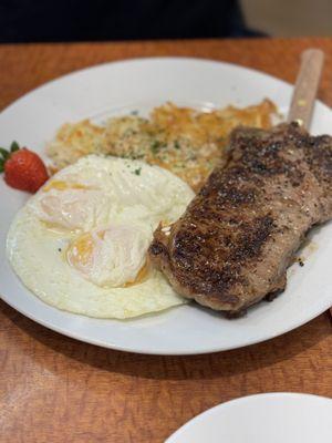 Steak & Eggs, medium rare w/over easy eggs and hash browns. Also comes with an English muffin.