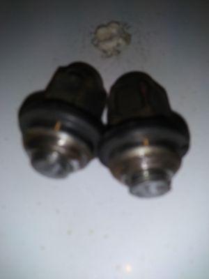 Both broken studs from Firestone's lack of understanding torque values.