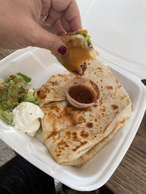 Shredded beef taco and salsa. That's the last bite pictured. And their chicken quesadilla. Yum.