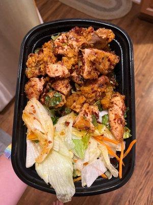 Szechuan Chicken in a to-go container