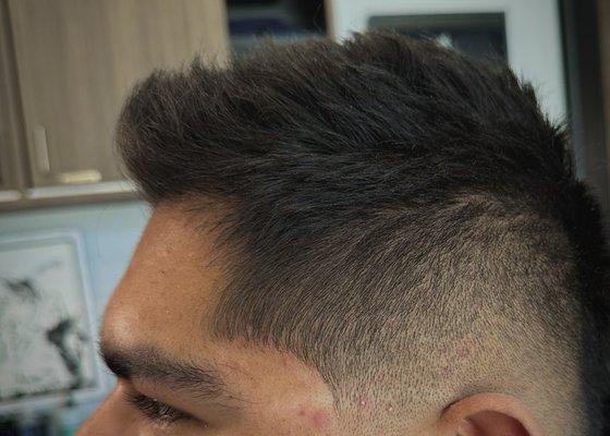 Zero fade. Choppy textured top.  Haircut by Alex.  Book online: bellandanchor.reserva.com