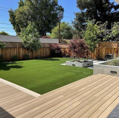 New landscape, decking, lighting & beautiful concrete planters