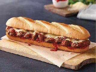 Meatball Sub - White, Provolone, Pizza Sauce, Parmesan and Meatball.