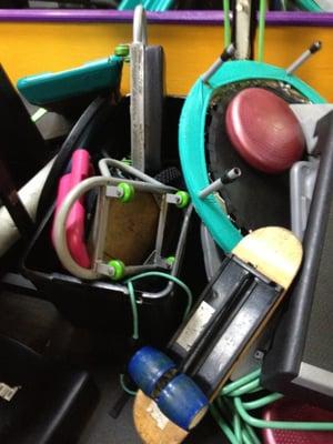 How gym equipment is stored in the middle of gym floor. Much of it is old and broken.