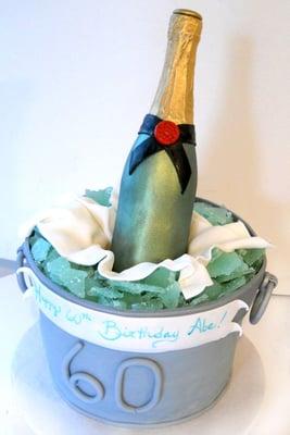 Chocolate bottle with real champagne inside bucket cake. Sugar ice. For an anniversary party