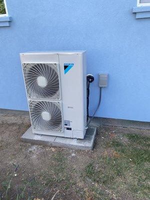 Daikin ductless mini split condenser installation.