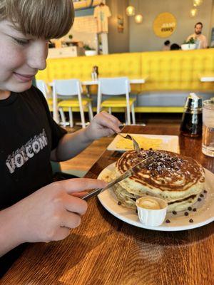 Chocolate chip pancakes-- big kid could only eat half of the stack. He appreciated the bacon and eggs too.