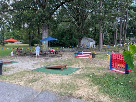 Yard games, picnic tables and umbrellas