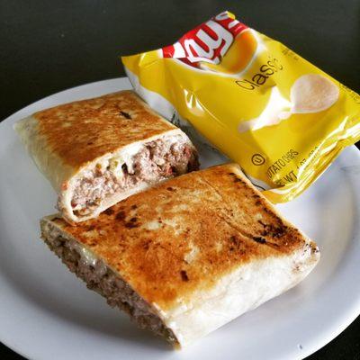 Steak and cheese wrap with mushrooms, onions, pickles, hots and lots of mayo!