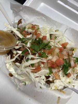 Papas Locas (crazy fries) with meat cheese cabbage slaw and salsa